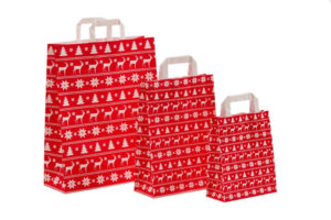 Weihnachtstasche vollflächig rot bedruckt, Elche und Norweger-Muster weiß ausgespart, die Tasche hat zwei Papierflachgriffe und ist in 3 Größen zu sehen