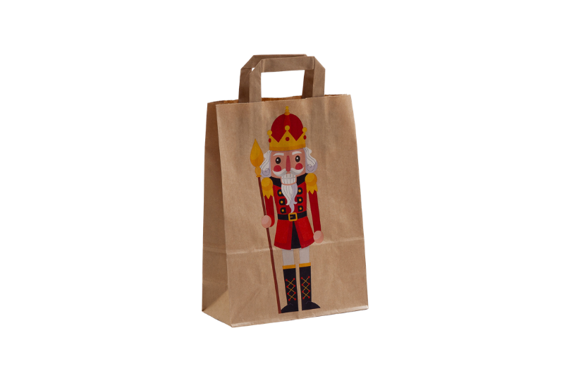 Weihnachtstasche Nußknacker aus Papier, bedruckt mit einem bunten Nußknacker, Jackenfarbe rrot, mittlere Größe bei tausendtypentragetaaschen.de